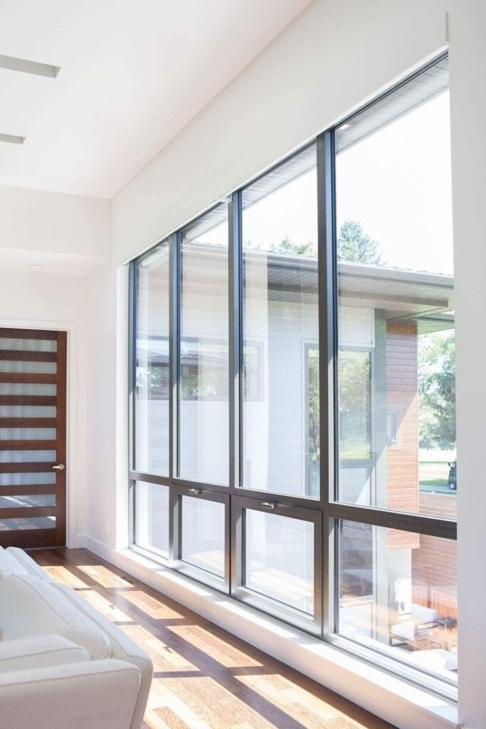 Large floor-to-ceiling modern windows bringing natural light indoors